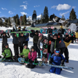 SOS Outreach Youth with their snowboards outside